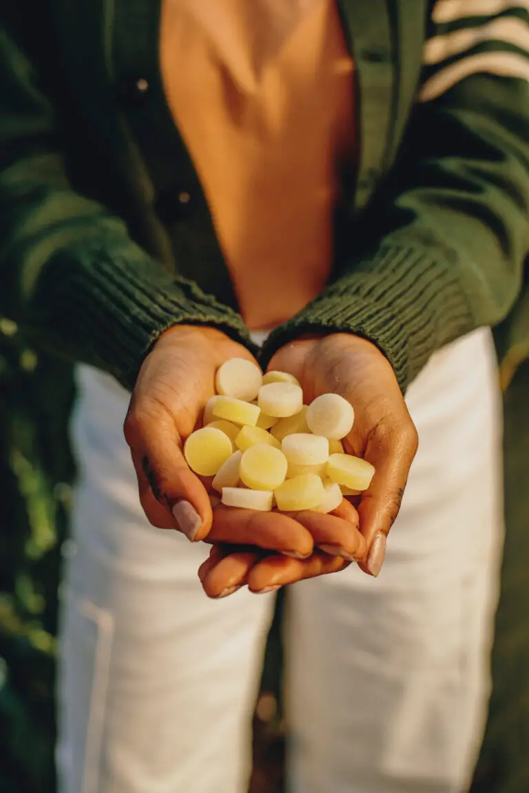 Image of hands clasped, carrying 10-20 KANHA Life THC gummies